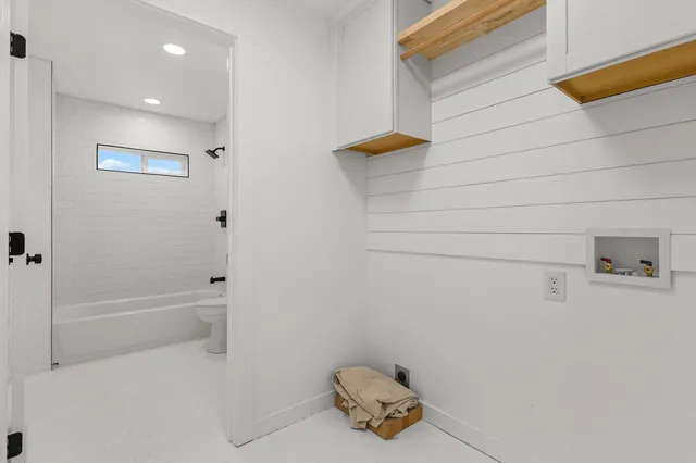 a bedroom with a large bed and a dresser