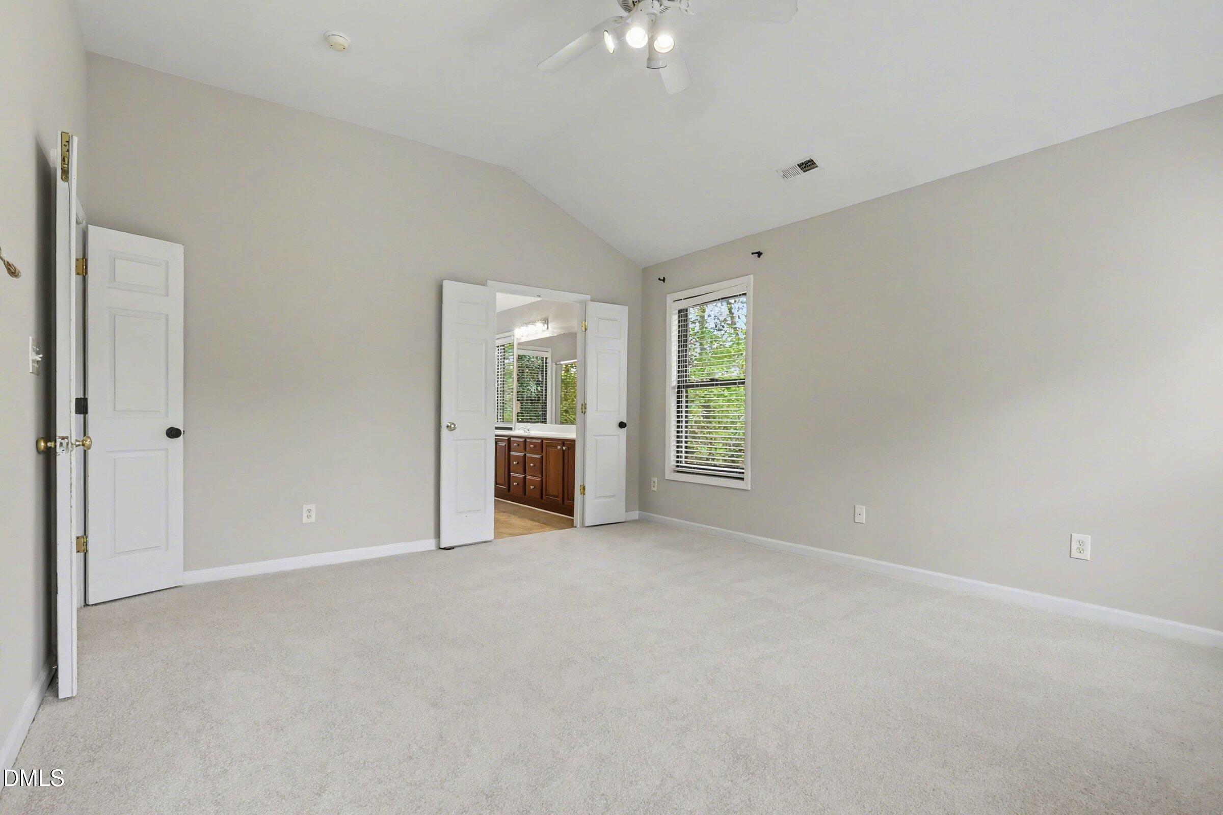 1001 Denfield Court Raleigh, NC 27615 - Photo 19 of 44 a view of an empty room with a window