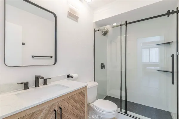 a view of parking garage with cars and other equipment