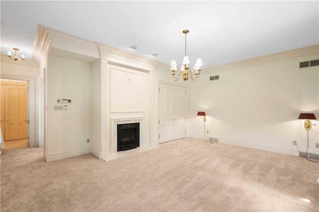 571 West McMurray Road Canonsburg, PA 15317 - Photo 20 of 47 Extensive crown molding, gas fireplace and elegant chandelier with tons of wall space for furniture.