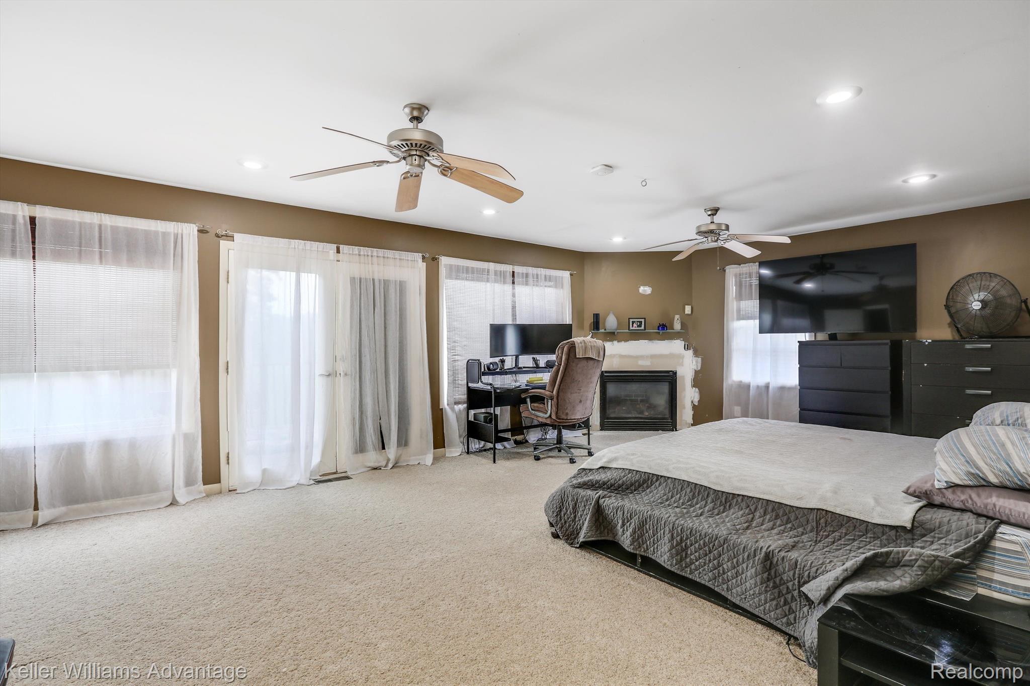 1460 Carleton Rockwood Road Carleton, MI 48117 - Photo 12 of 36 Master Suite with a 3rd Gas Fireplace & a Balcony