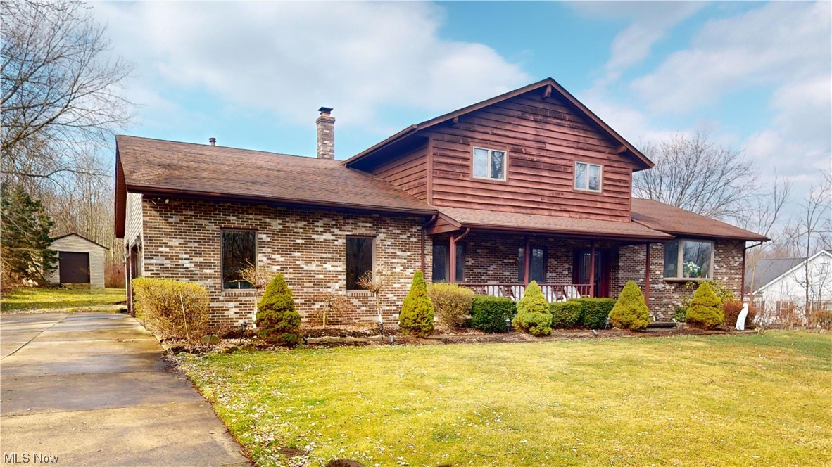 2980 Worrell Road Willoughby, OH 44094 - Photo 1 of 43 View of front facade featuring a front yard and a storage shed