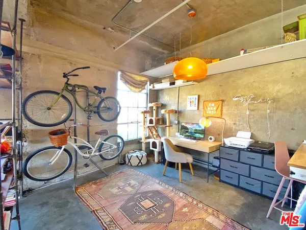 a kitchen with stainless steel appliances kitchen island granite countertop a refrigerator and stove