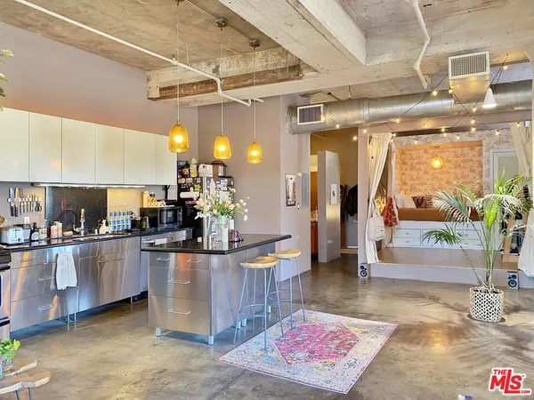 a view of a bathroom with a tub and shower