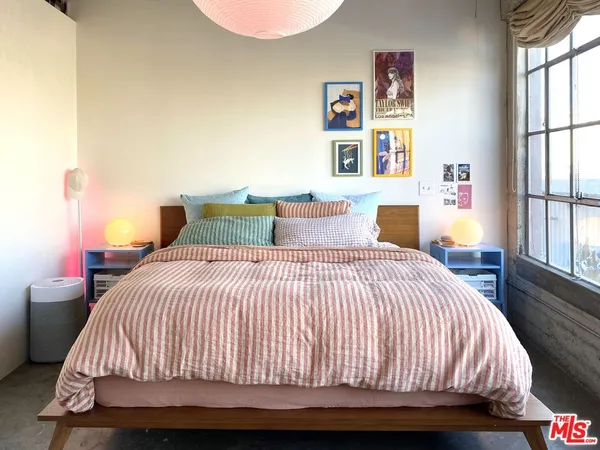 a view of a room with wooden floor and windows