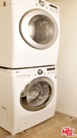 a lobby with furniture and a chandelier