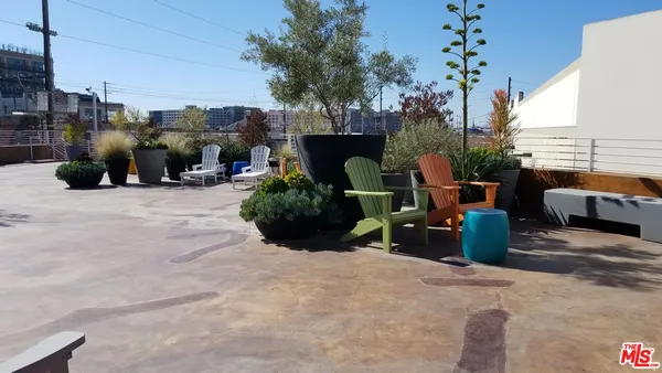 a view of a flower pot with potted plants