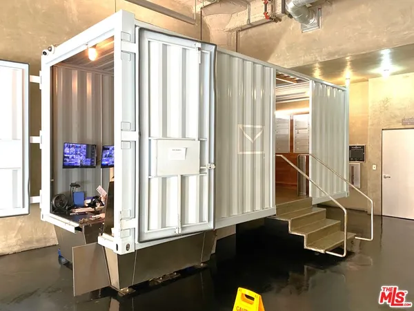 a view of room with window and wooden floor