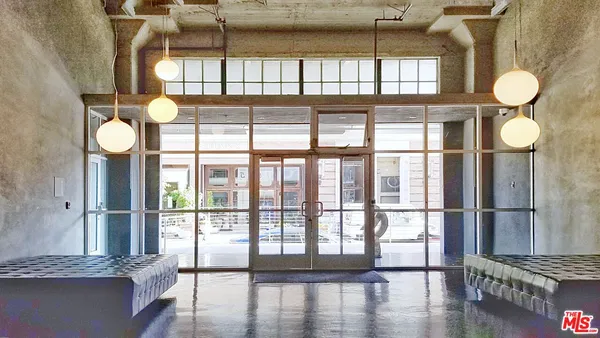 a front view of a building with glass windows