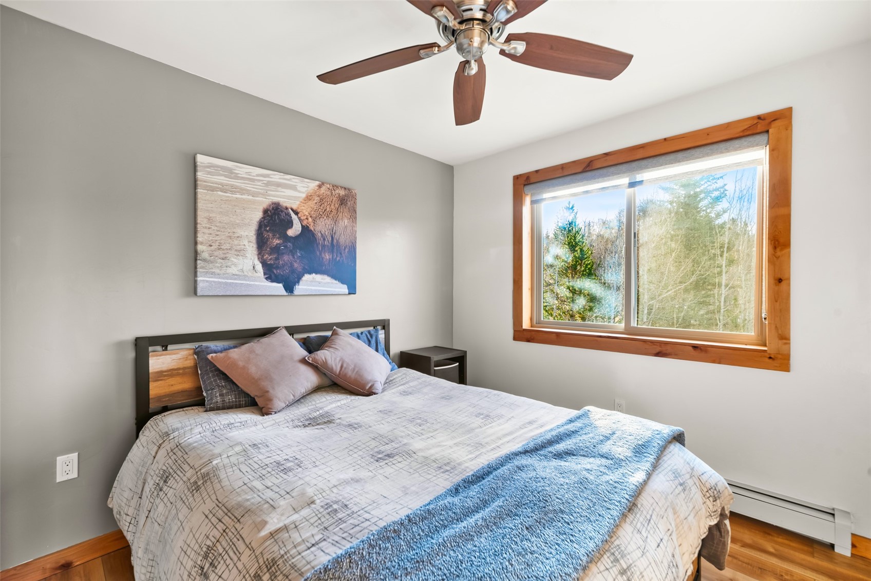 440 Arland Road Como, CO 80432 - Photo 9 of 49 a bedroom with a bed and a painting on the wall