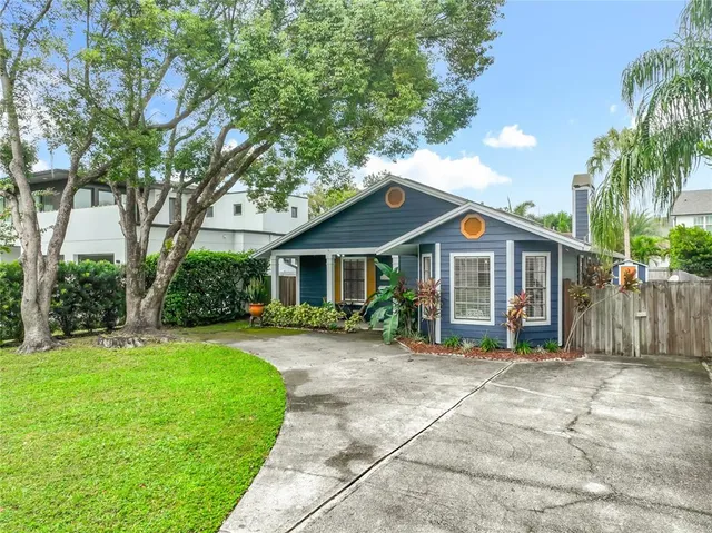 a front view of a house with a yard and porch