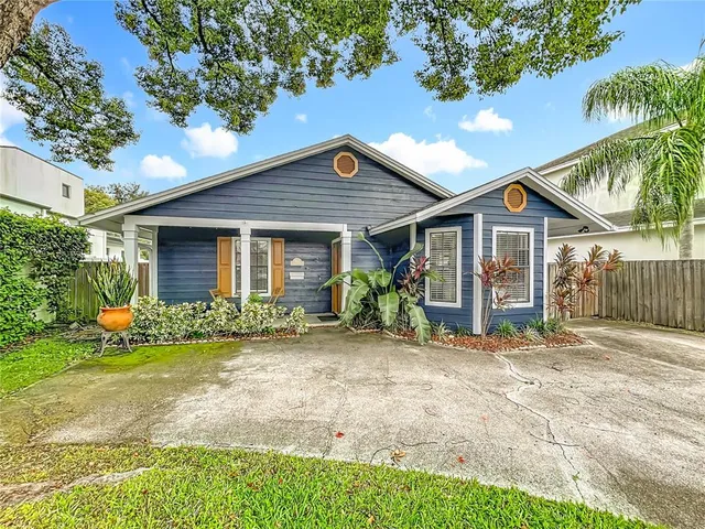 a view of a house with a yard patio and a patio