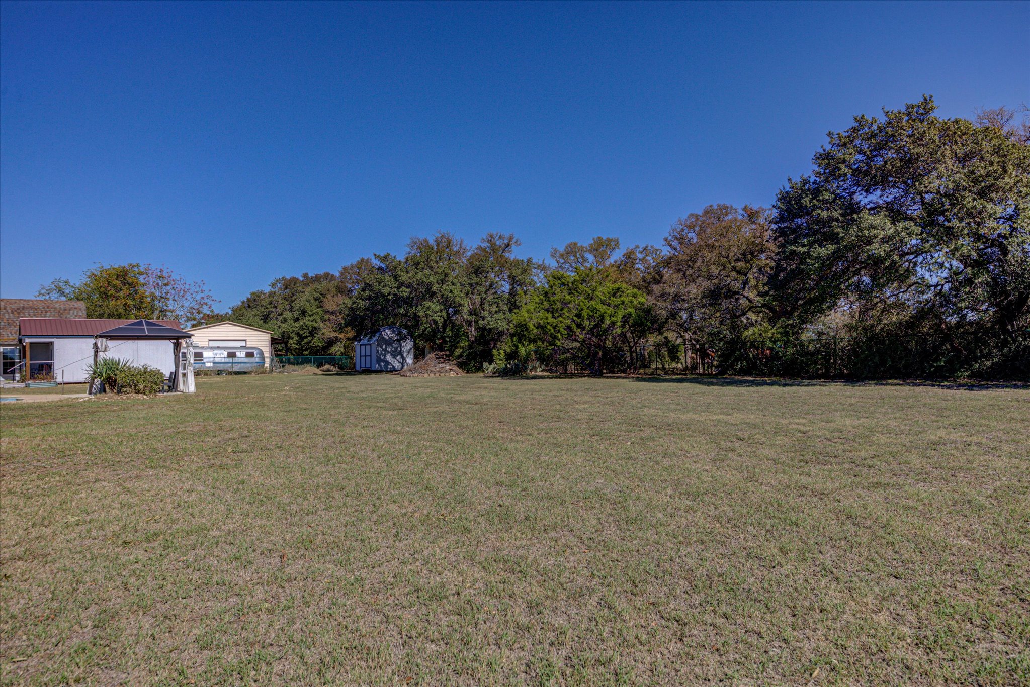 200 Harbor Circle Georgetown, TX 78633 - Photo 26 of 38 a view of a field with some trees in front of it