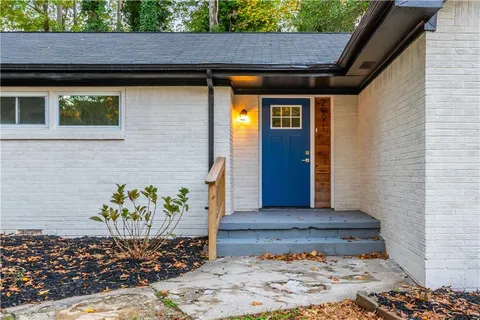 a view of a wooden door of the house
