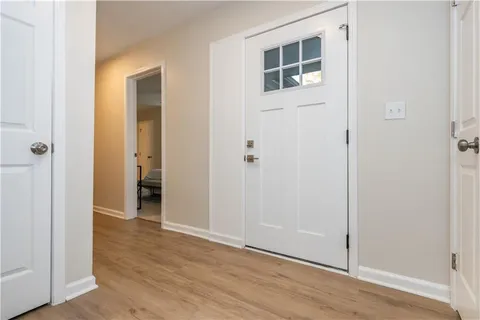 a view of a livingroom with wooden floor and closet