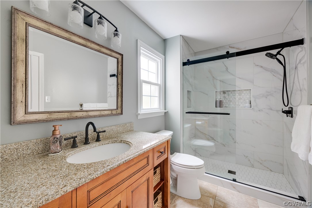 15201 Windy Ridge Road Midlothian, VA 23112 - Photo 17 of 30 a bathroom with a granite countertop sink toilet and shower