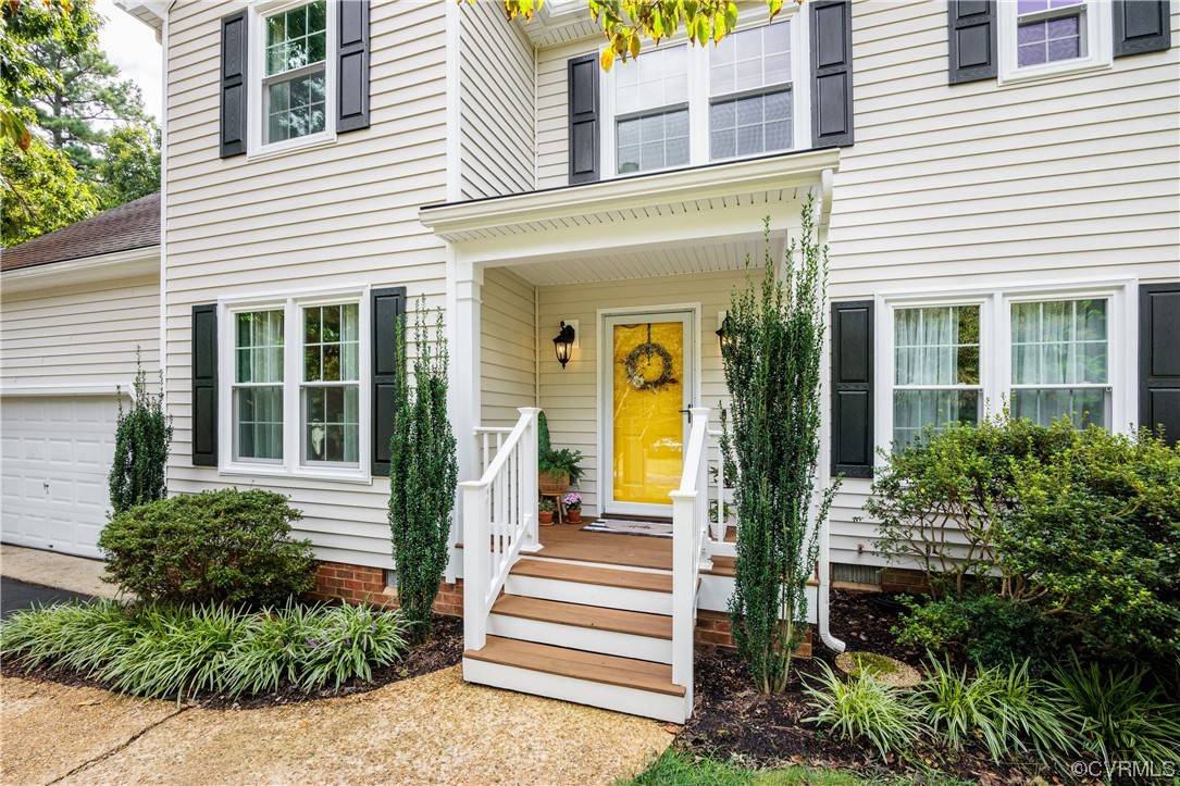 15201 Windy Ridge Road Midlothian, VA 23112 - Photo 2 of 30 a front view of a house with a porch