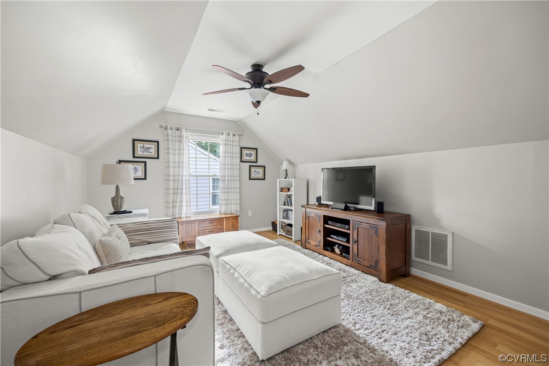 15201 Windy Ridge Road Midlothian, VA 23112 - Photo 21 of 30 a living room with furniture and a flat screen tv