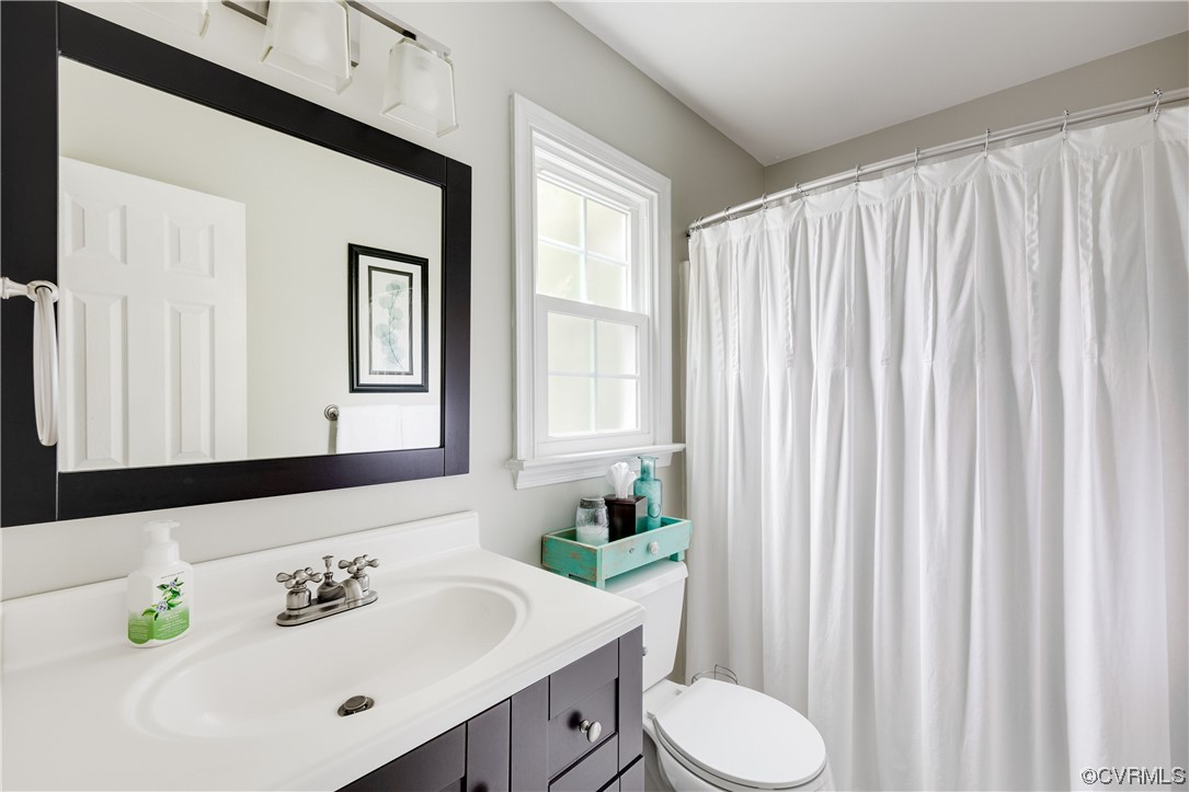 15201 Windy Ridge Road Midlothian, VA 23112 - Photo 23 of 30 a bathroom with a sink and a mirror