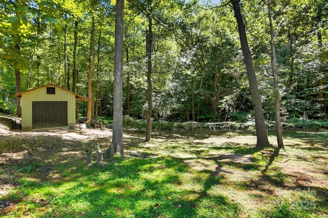 a kitchen with a refrigerator sink and cabinets