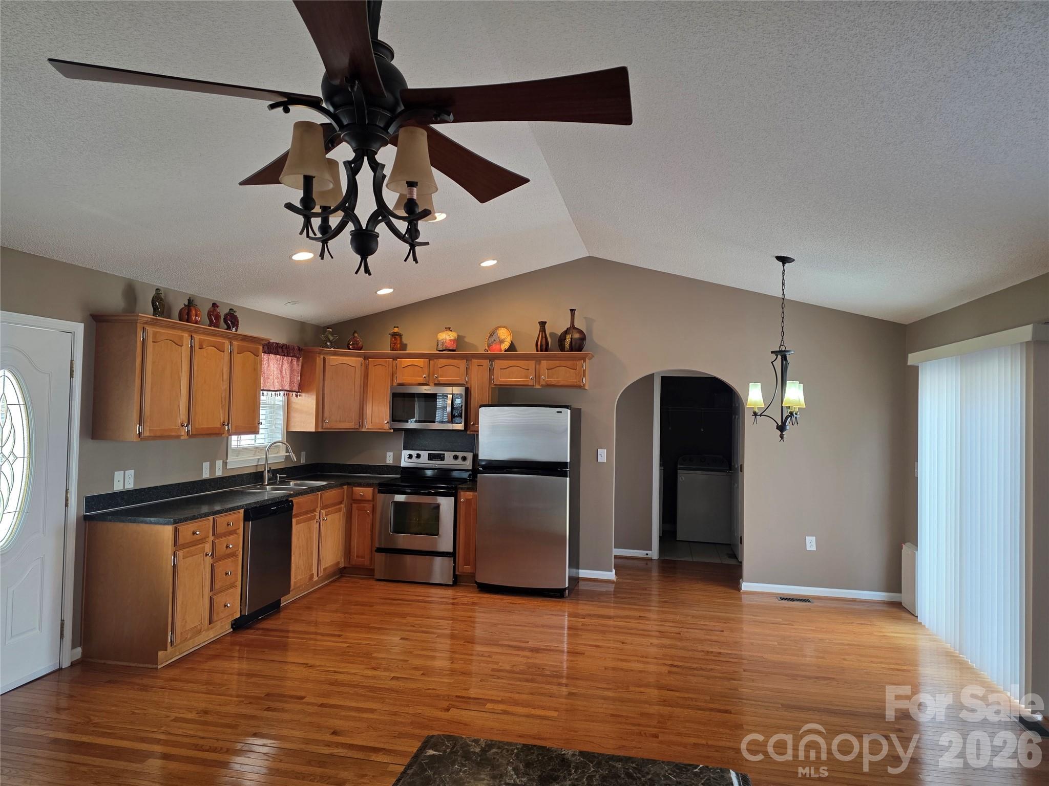 2034 Red Berry Lane Conover, NC 28613 - Photo 5 of 5 a kitchen with stainless steel appliances granite countertop a sink and a stove