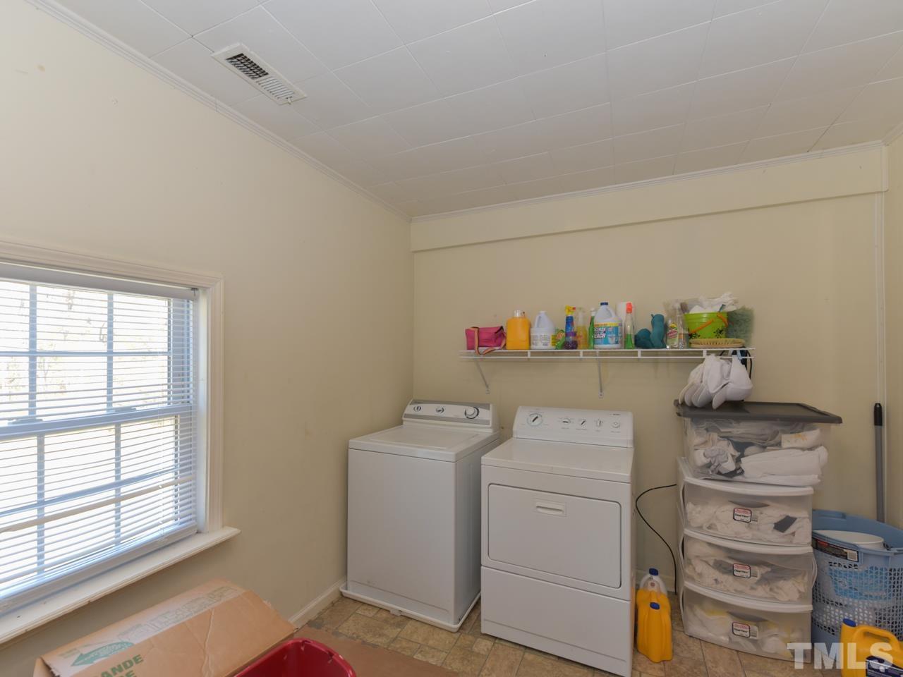203 Smith Drive Garner, NC 27529 - Photo 11 of 13 a utility room with dryer and washer