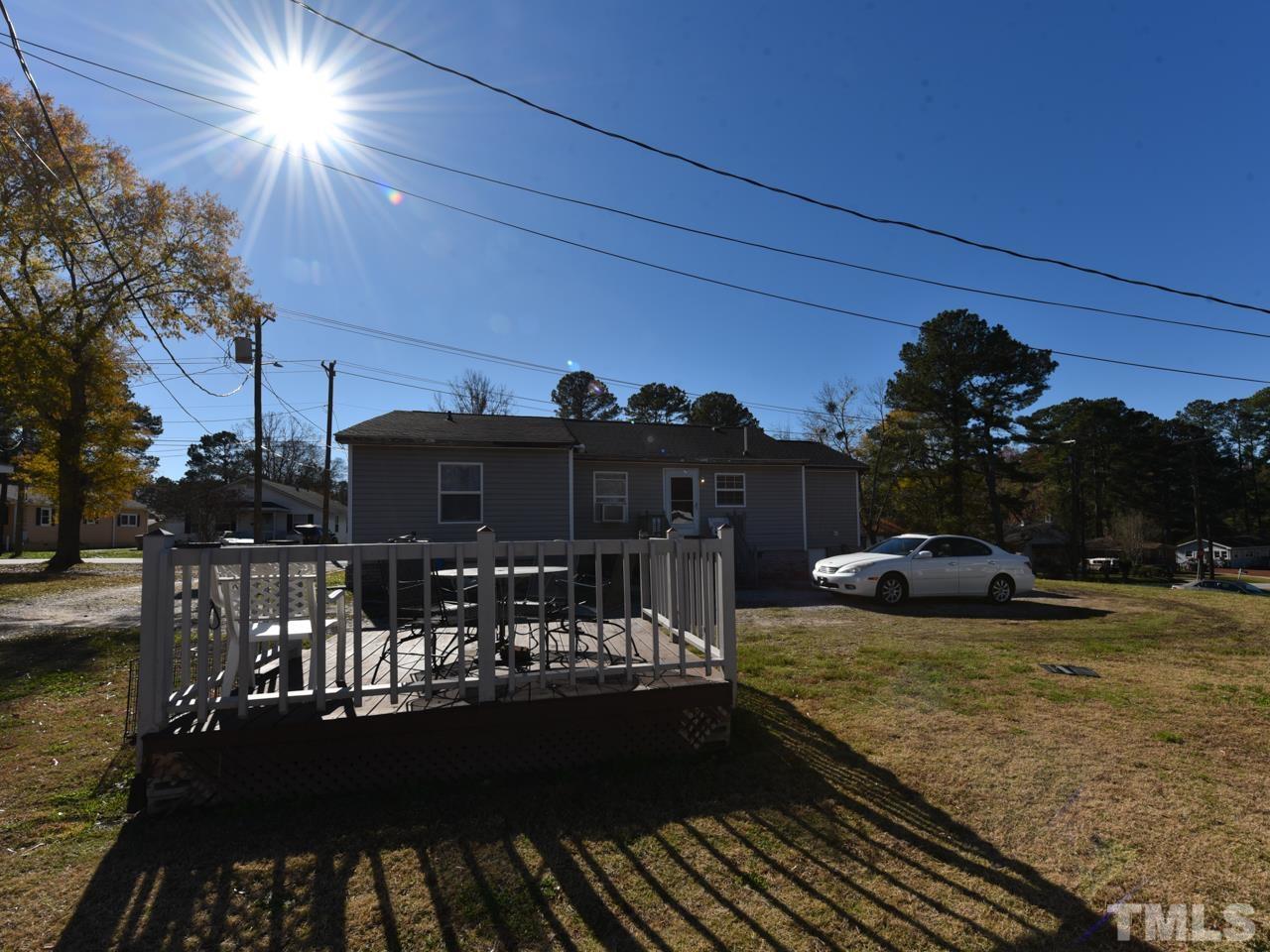 203 Smith Drive Garner, NC 27529 - Photo 12 of 13 a view of a house with backyard and lake view