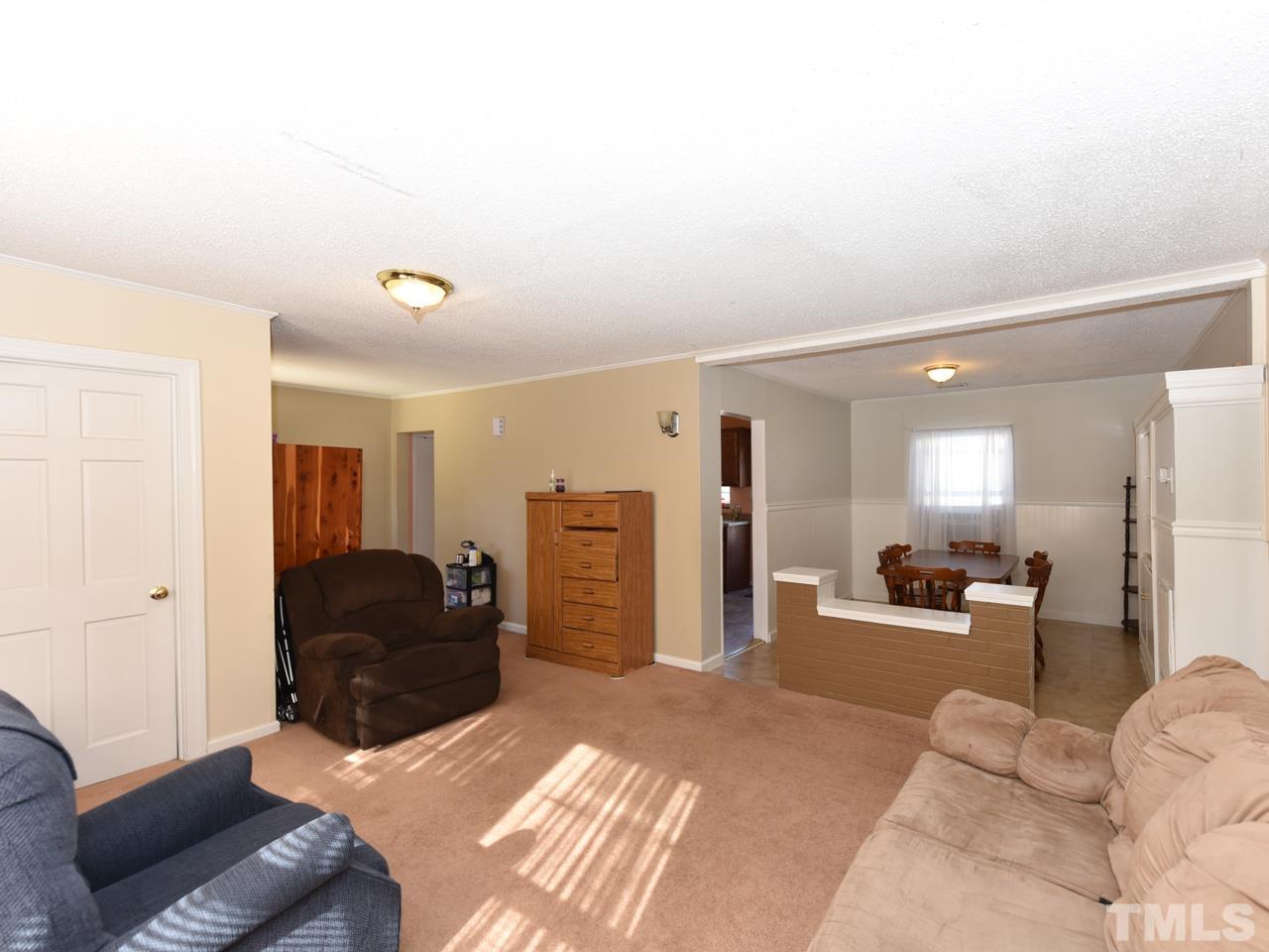 203 Smith Drive Garner, NC 27529 - Photo 7 of 13 a living room with furniture