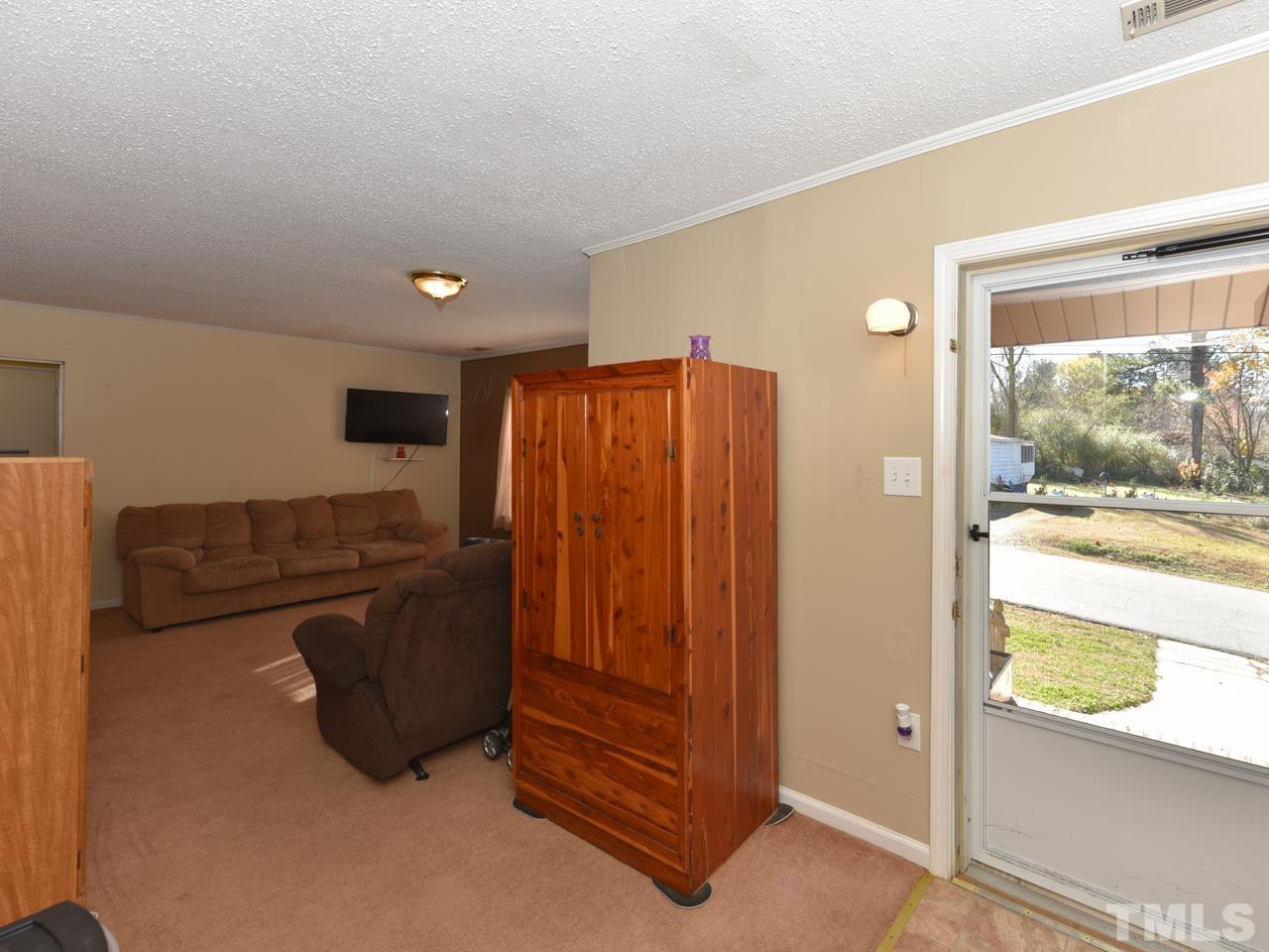 203 Smith Drive Garner, NC 27529 - Photo 8 of 13 a very nice looking room with a large window