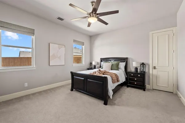 a bedroom with a bed and window