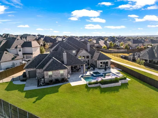 an aerial view of a house with swimming pool lake view and boat