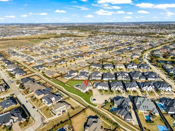 an aerial view of residential building with ocean view