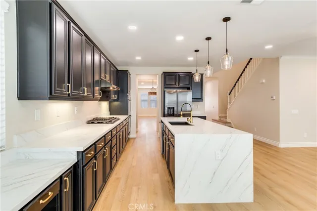 a view of an empty room with a fireplace and a window