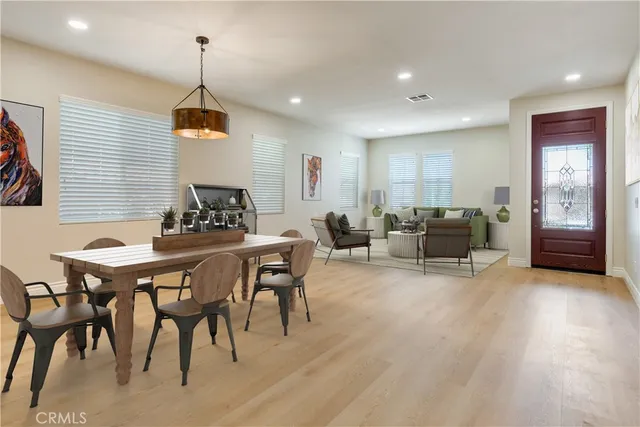 a view of a walk in closet and living room view