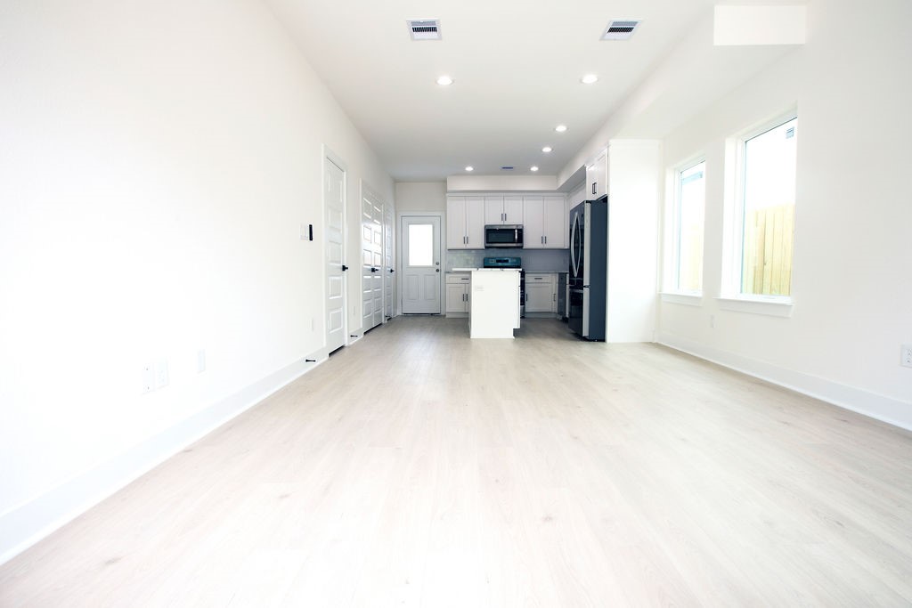 4137 Mallow Street, Unit A Houston, TX 77051 - Photo 11 of 16 a kitchen with a refrigerator and window