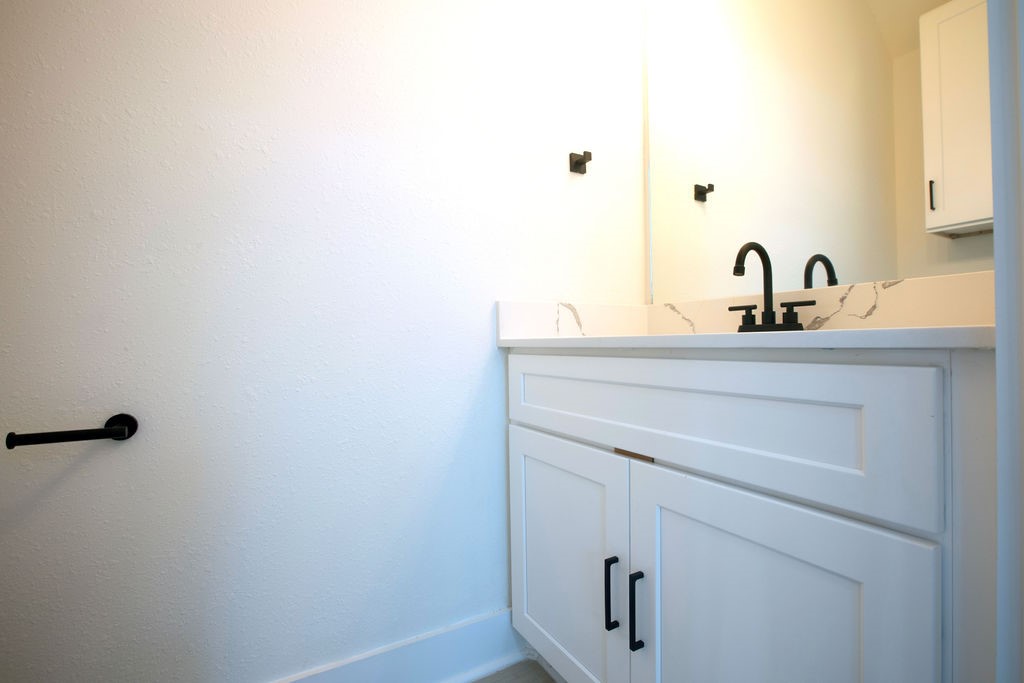 4137 Mallow Street, Unit A Houston, TX 77051 - Photo 12 of 16 a bathroom with a sink and a mirror