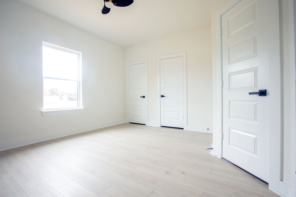 4137 Mallow Street, Unit A Houston, TX 77051 - Photo 5 of 16 an empty room with windows and closet