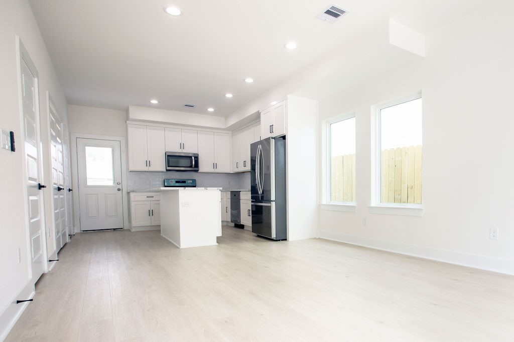 4137 Mallow Street, Unit A Houston, TX 77051 - Photo 10 of 16 a view of a kitchen with refrigerator and windows