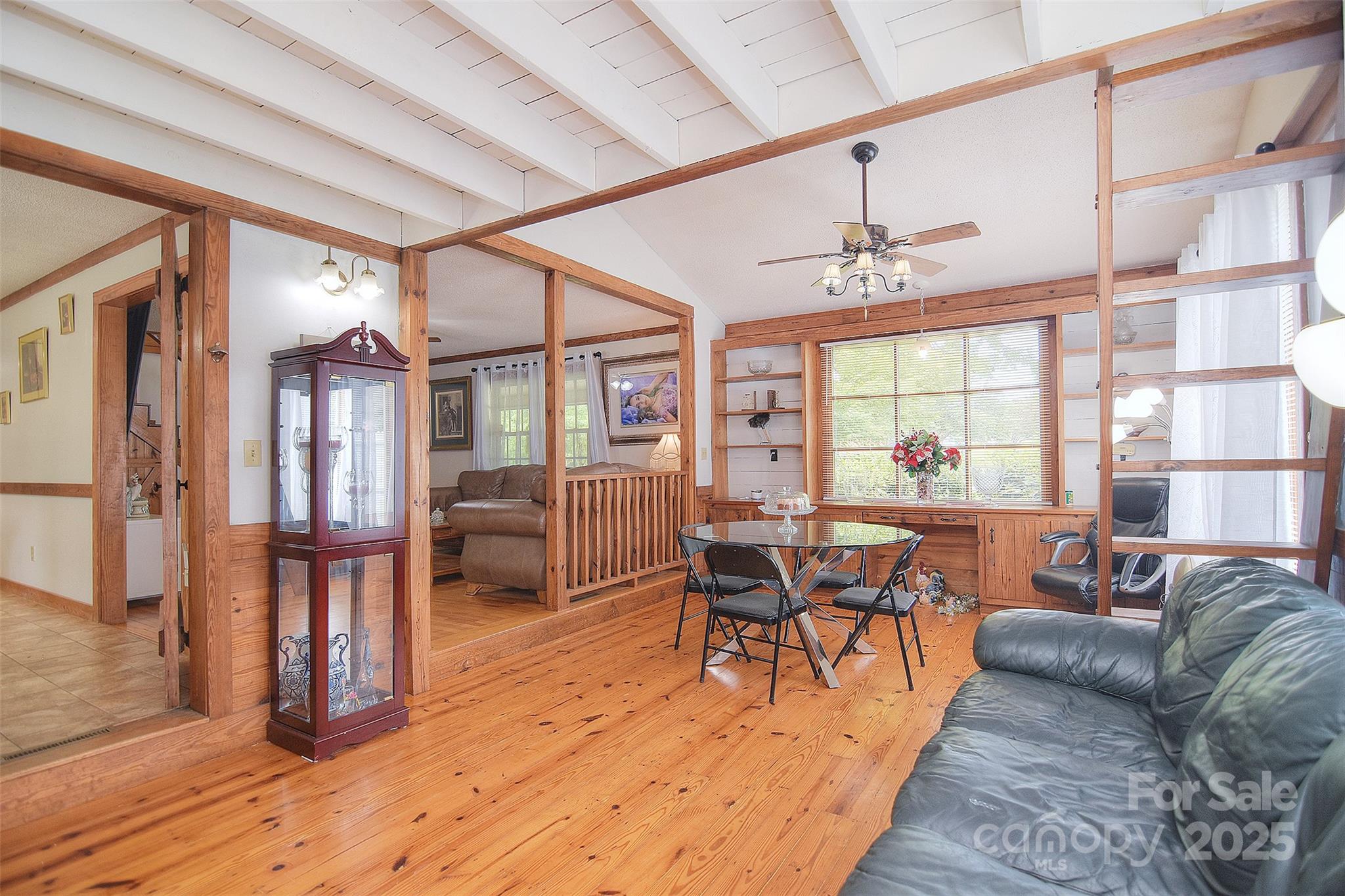 109 Larch Road Salisbury, NC 28147 - Photo 12 of 43 a living room with furniture a dining table and wooden floor
