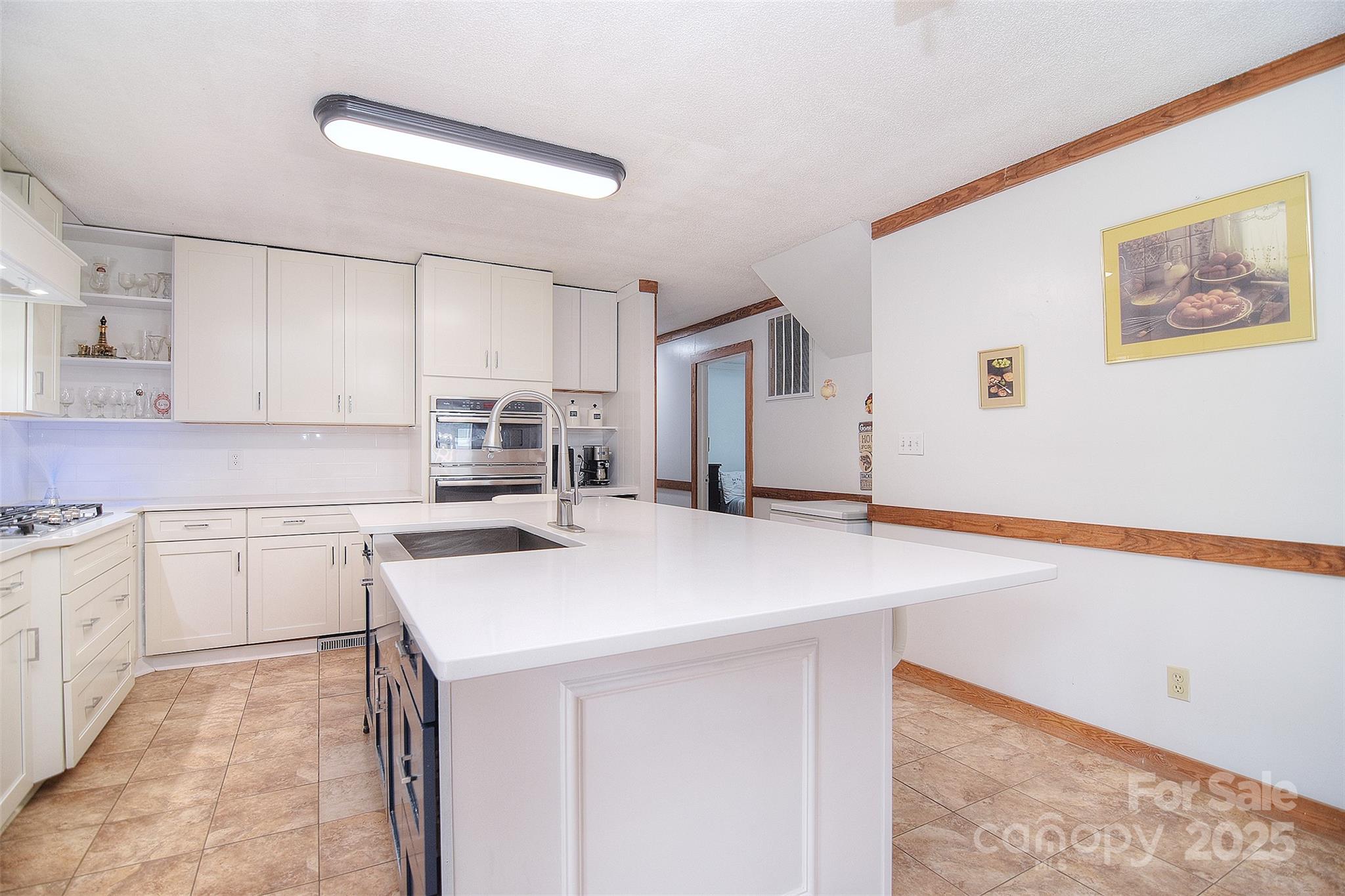 109 Larch Road Salisbury, NC 28147 - Photo 20 of 43 a kitchen with a sink a stove and cabinets