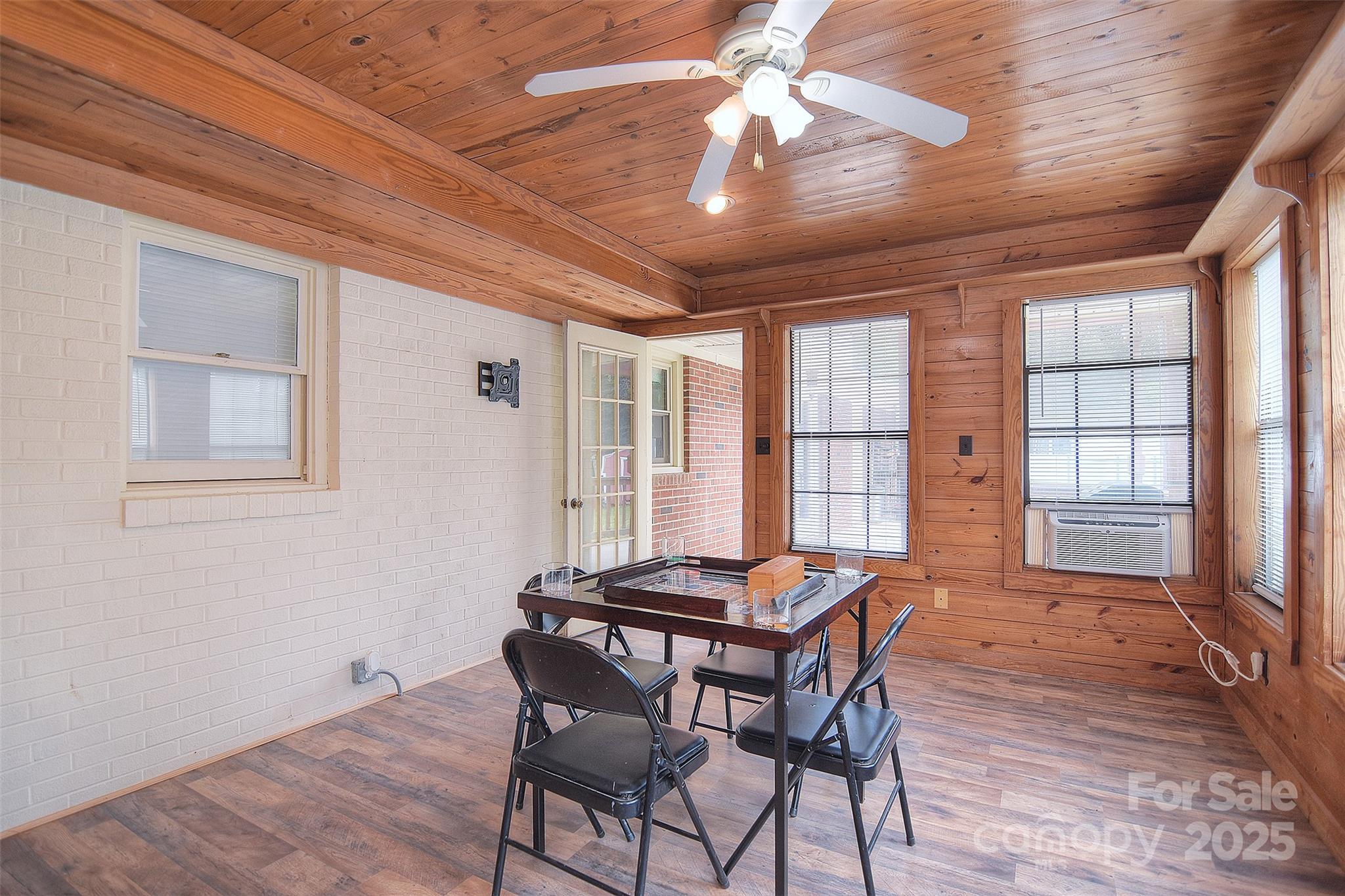 109 Larch Road Salisbury, NC 28147 - Photo 22 of 43 a dining room with furniture a chandelier and wooden floor