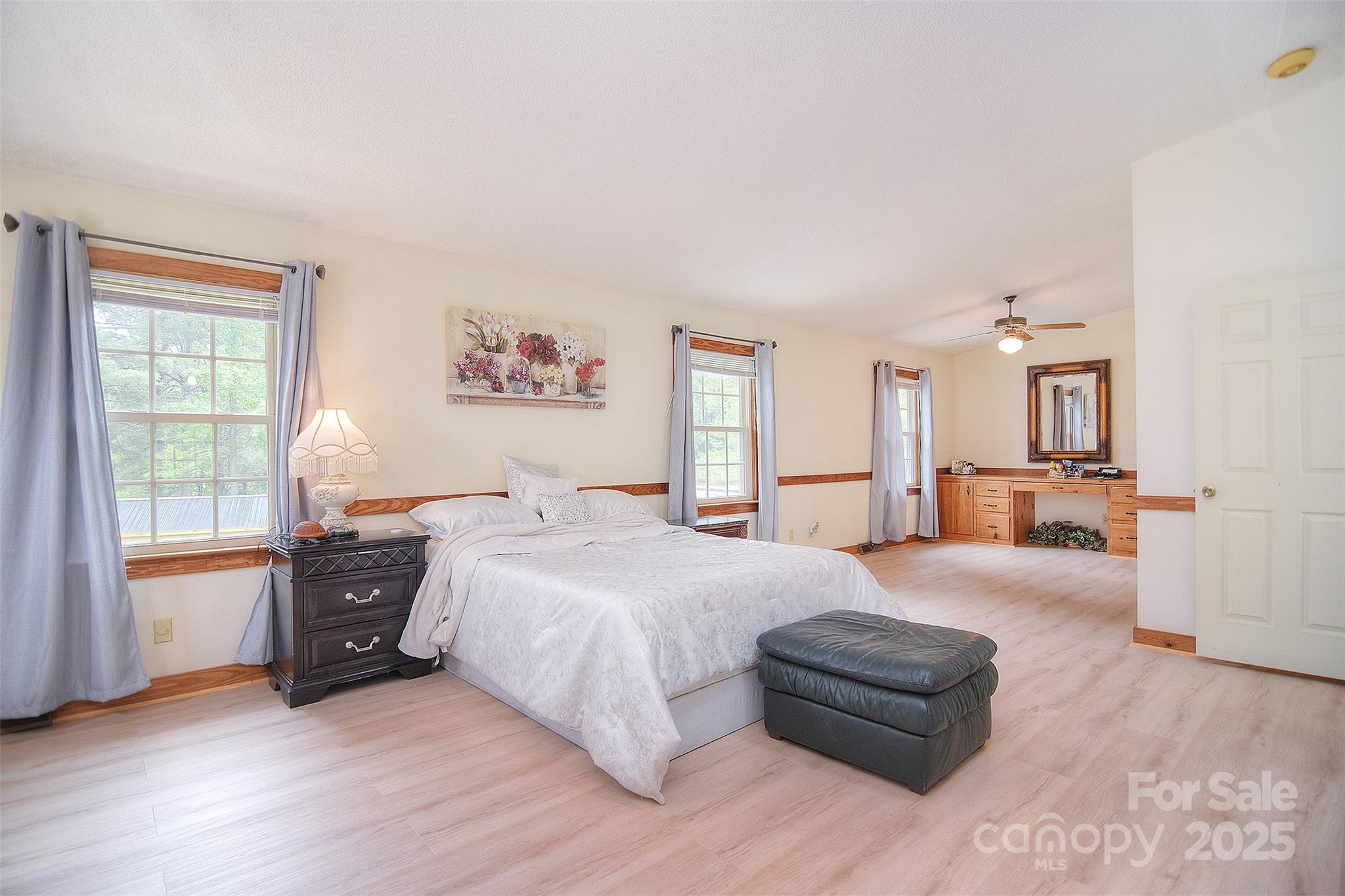 109 Larch Road Salisbury, NC 28147 - Photo 25 of 43 a spacious bedroom with a bed and a couch