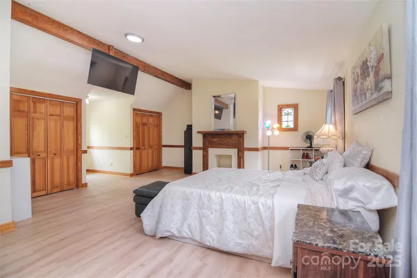 a kitchen with stainless steel appliances granite countertop a stove and a wooden floors
