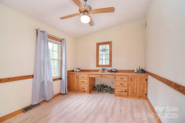 a bathroom with a glass shower door and a toilet