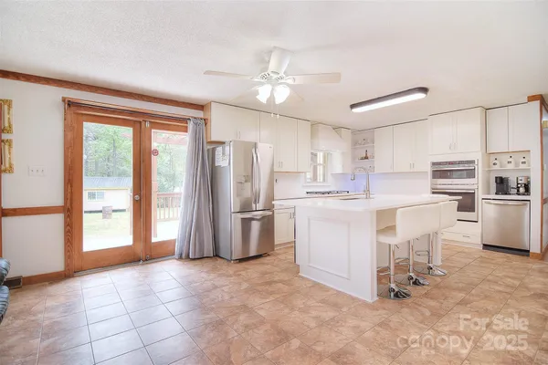 a spacious bedroom with a bed and a fireplace