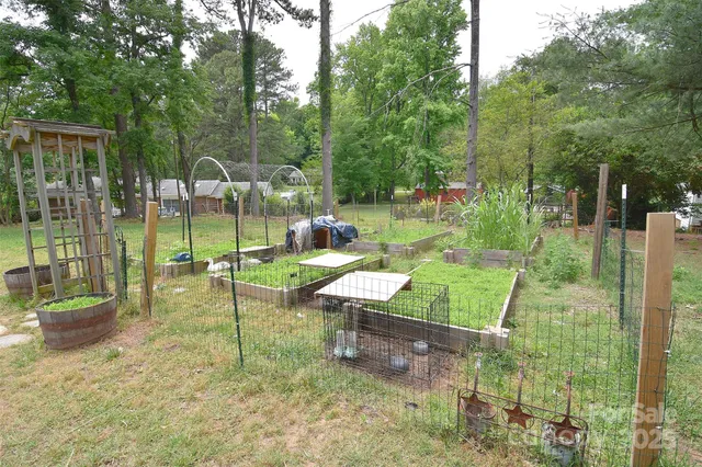 a view of a backyard with a sitting area