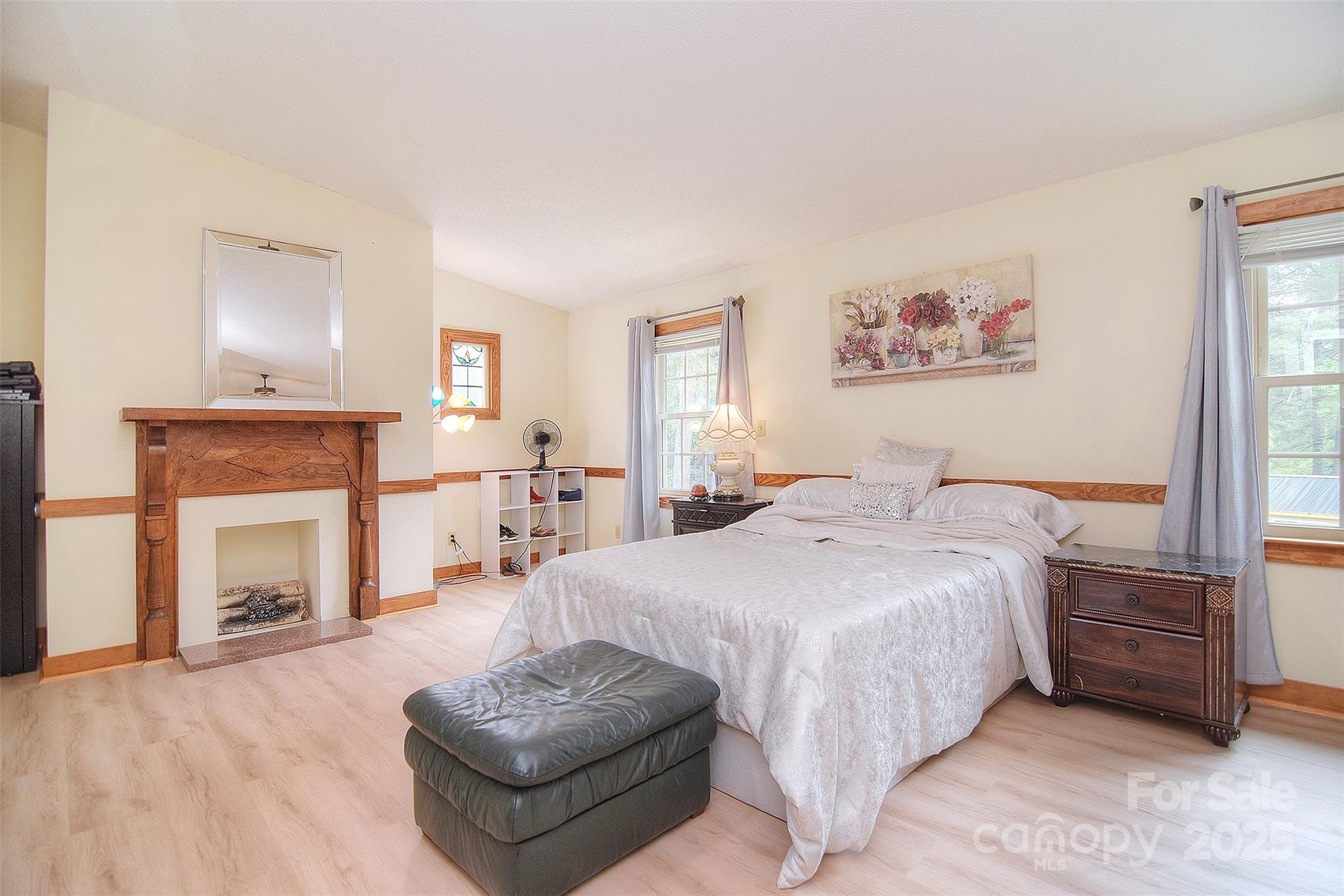 109 Larch Road Salisbury, NC 28147 - Photo 4 of 43 a spacious bedroom with a bed and a fireplace