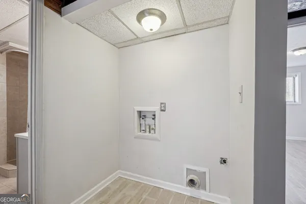 a bathroom with a window and a shower
