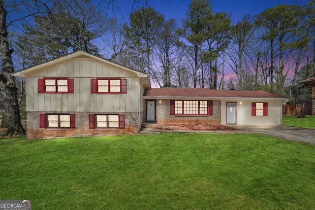 a front view of a house with a yard