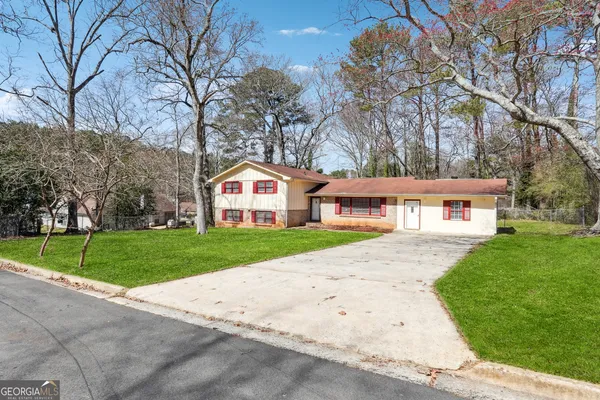 a front view of a house with a yard